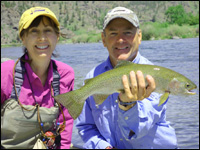 Sue Ukena and Orvis 2014 Guide of the Year, Tim Linehan, with a Missouri River rainbow that fell to Bastian's Floating Caddis Emerger.